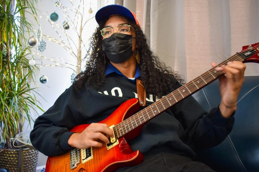 Isaiah Guerrero plays guitar with BAOBAB at Eminent DoMane Barbers Lounge & Podcast Studio in Sacramento, California, Tuesday, Dec. 8, 2020. The band participated in The State Hornets third installment of Stinger Sound Sessions. 