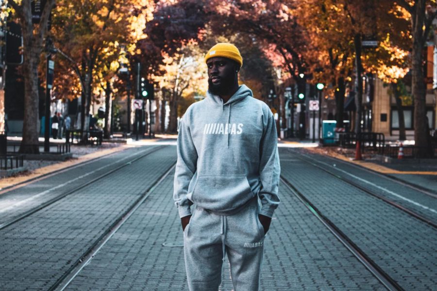 Farouq Gidado, founder and owner of ABAS Clothing, poses on K Street in Downtown Sacramento Sunday, Nov. 22, 2020. The acronym ABAS stands for “always be about something, which Gidados childhood friend said one day while trash talking on the basketball court.
