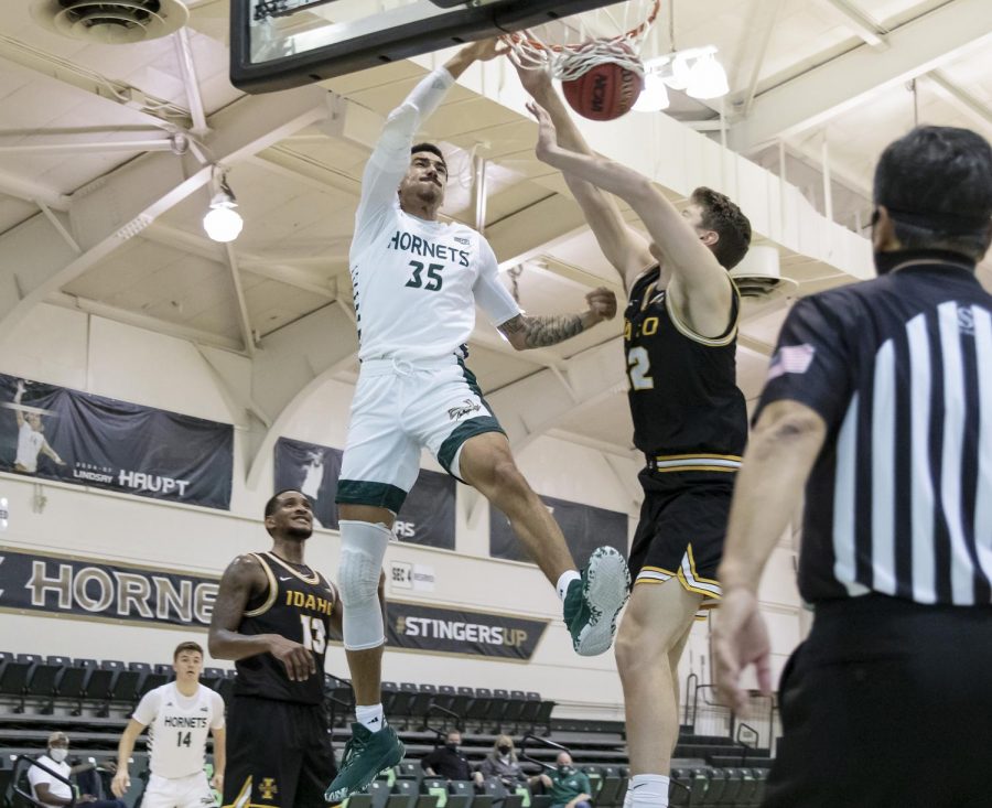 Sacramento State’s Christian Terrell (35) drives to the basket with 10 seconds left on the shot clock and dunks the ball over Idaho’s Tanner Christensen (32) during the second half in the conference opener in the game against the University of Idaho at The Nest at Sac State Thursday, Dec. 3, 2020. Terrell had 15 points in the game. Sac State won 77-55.