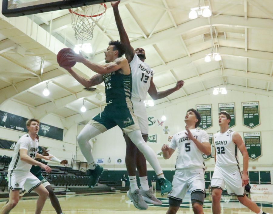 Sacramento State's junior guard Deshaun Highler (12) makes an under the basket scoop lay up during the second half in the game against the University of Idaho at The Nest at Sac State Saturday, Dec. 5, 2020. Highler had 10 points in the game. Sac State won 73-57.
