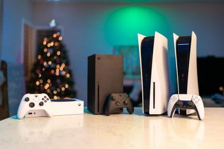 Left to Right: The Xbox Series S, Xbox Series X, PlayStation 5, and PlayStation 5 Digital Edition have officially begun the next generation of gaming. With lighting fast loading times, ray tracing, 120 frames per second, and near silent fan speeds across all systems, these consoles are aimed at removing as many barriers from the gamer to the game. 