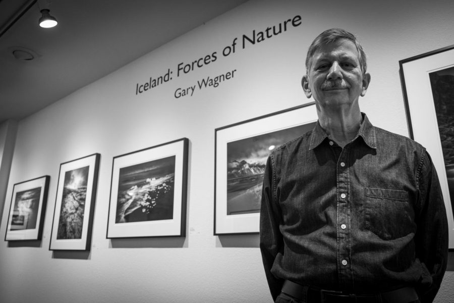 Northern California photographer Gary Wagner poses in front of his Iceland: Forces of Nature photo gallery at the Viewpoint Photographic Art Center Tuesday, Nov. 15, 2020. Wagner said he prefers to photograph exclusively in black and white  to emphasize that the photos are interpretations. 
