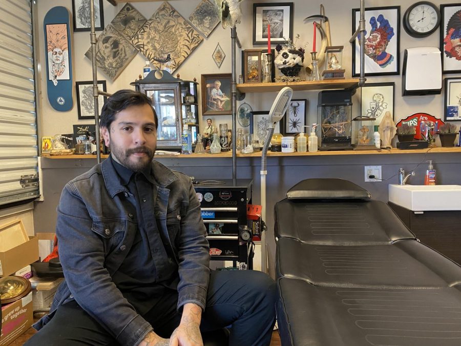Osman De Los Santos, 27, in his private tattoo studio in Sacramento, Calif. on Dec. 7, 2020. In his free time, De Los Santos makes art commissions which he displays on the walls of his shop. 