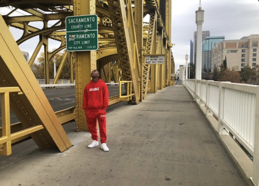 Xzavion Stevenson,22, admiring the Sacramento County and City limit sign. Stevenson recently finished third in the most recent "Sac State's Got Talent." Photo Courtesy of Xzavion Stevenson.