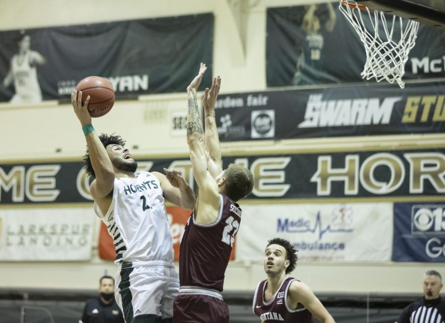 Sacramento State Hornets forward Ethan Esposito (22) draws the foul from Montana Grizzlies forward Mack Anderson (23) during the second half of the conference game at the Nest at Sac State Thursday, Jan. 21, 2021. Esposito made both free throws.