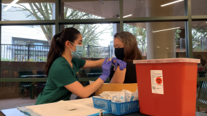 Nursing student Carmel Stewart receives her first dose of the Pfizer COVID-19 vaccine in the Brown Bag Room of the University Union on Thursday, Jan. 28, 2021. Sacramento State began its first rounds of vaccinations Thursday.