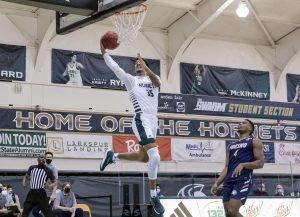 Sacramento State’s Christian Terrell (35) makes a fastbreak layup past Fresno Pacifics Aamondae Coleman (4) during the first half of the home game Sunday, Jan. 3, 2021. Terrell had 20 points in the first half and 26 points total.