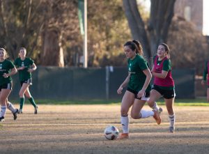  Senior forward Alyssa Baena dribbles the ball down the pitch during practice Saturday, Feb. 5, 2021 at the Sacramento State Soccer field. As a senior, Baena said she is excited to get back on the pitch after wondering if she would ever get to play soccer in college again.