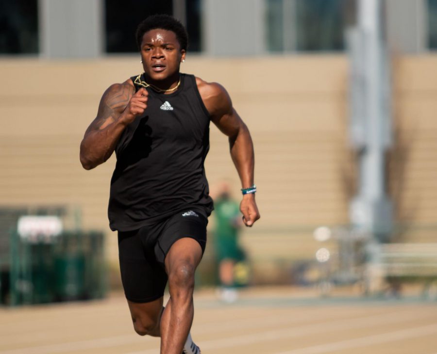 Sacramento State football and track and field athlete Elijah Dotson runs at a track and field practice at Hornet Stadium on February 13, 2021. “I just want to be that guy, and me working everyday is the best way for me to do it,” Dotson said.