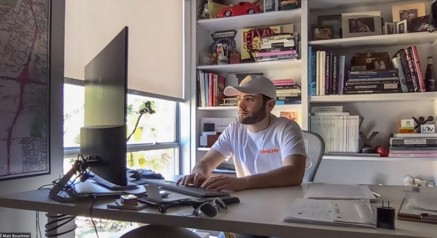 President and co-founder of MealMe Matthew Bouchner works on a computer at his family’s home on Friday, Feb. 19, 2021. Designed alongside co-founder Will Said as a streamlined food photography app last March, MealMe found its niche as a price comparison tool between food delivery services such as Postmates, GrubHub and Doordash. (Taken via Zoom)
