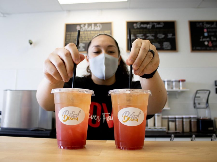 Blend owner Jennifer Duffey makes two drinks for customers on Saturday, Feb. 13, 2021. The menu includes items such as coffee, tea, juice and smoothies.