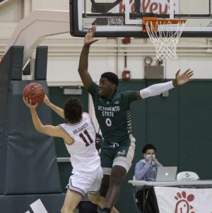 Montana Grizzlies guard Cameron Parker (11) attempts a layup over Sacramento State Hornets forward Samaad Hector (0) during the second half during the conference game at the Nest at Sac State Saturday, Jan. 23, 2021. Hector said he got sick and is awaiting COVID-19 test results. 