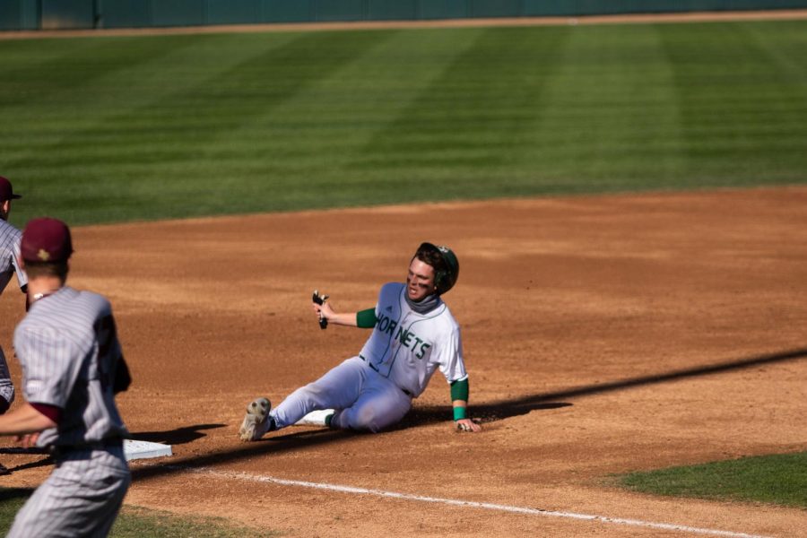 Right fielder Trevor Doyle steals third after stealing second on a Texas State error in the bottom of the second. The Hornets beat the Texas State Bobcats 4-8 in the first game out of a doubleheader at John Smith Field Saturday February 27 2021. 
