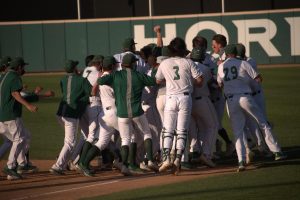 The Sacramento State baseball team rushes the field after Matt Smith’s walk-off hit during the ninth inning of the home game against Stanford University at John Smith Field on Monday, March 29, 2020. The Hornets were named the 24th ranked team on Collegiate Baseball’s top-25 poll on Monday, marking the first top-25 ranking in Sac State history. 

