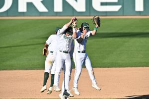 From left to right, Sac State baseball players Keith Torres, Steven Moretto, Ryan Walstad celebrate the Hornets’ win against Dixie State on Friday at John Smith Field. 

