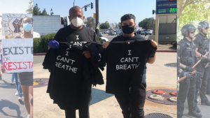 Robert Gonzalez stands next to a t-shirt seller at a gas station during a George Floyd Protest in Fontana, California on Wednesday, May 27, 2020. Gonzalez said he was shocked by the results of the Derek Chauvin trial. Background photos taken by Ian Ratliff (left) and Sara Nevis (right).  