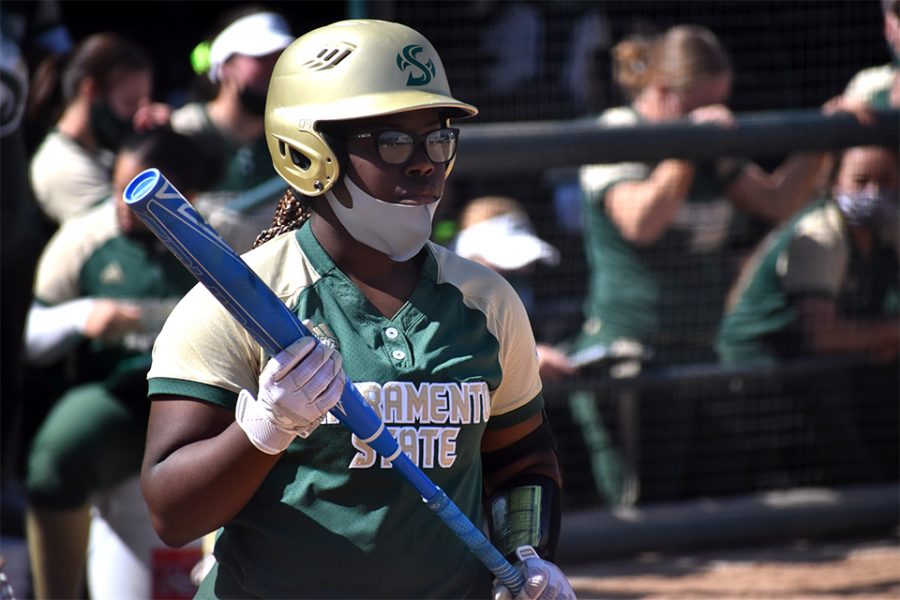 Lewa Day visualizes her hit while at bat against Santa Clara University during the Capital Classic at the Shea Stadium at Sacramento State on March 5, 2021. Lewa Day has played in all 30 of the games that the team has played so far this season.
