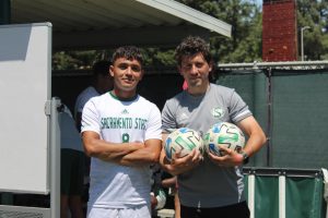 Sophomore midfielder Axel Ramirez (left) and assistant coach Pedro Lupercio (right) at Hornet Field after the spring exhibition game on May 8, 2020. Ramirez said the team was excited to finally get back on the field after a year and a half of no games.
