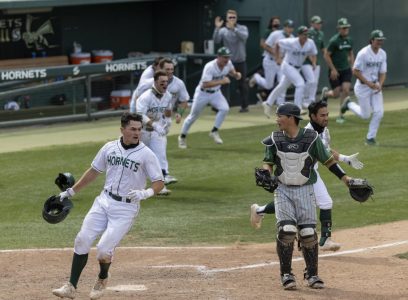 Sacramento State junior Dawsen Bacho crosses home plate as the team rushes the field after the walk-off win in the bottom of the seventh inning in game one against the University of San Francisco at John Smith Field at Sac State on Saturday, May 15, 2021. Moretto had three at-bats with one hit.