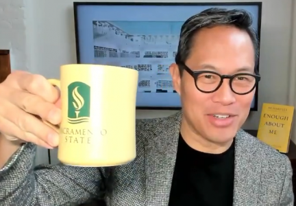 Richard Lui shows off his Sac State coffee mug during the Zoom webinar for APIDAs in the arts and entertainment industry on Sept. 17, 2021. He was chosen as a speaker because of his reputation as the first Asian American male to anchor a daily national news broadcast. (Screenshot: Zachary Cimaglio via Zoom)