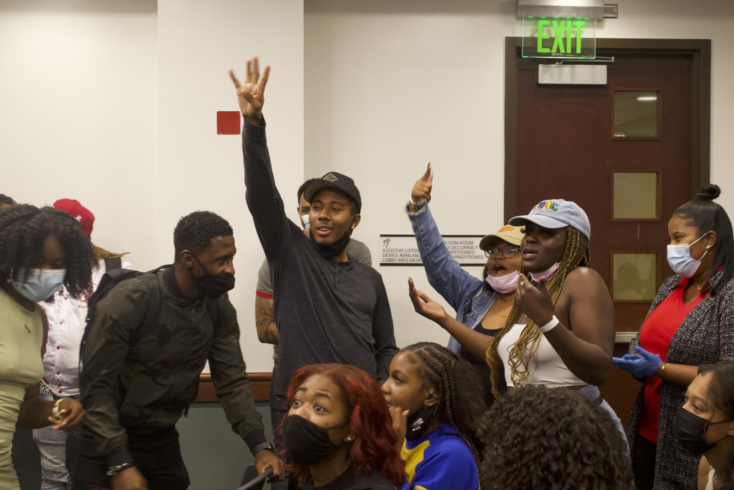 Khalil Ferguson, one the founding members of BSU and current president of the Black Alumni Chapter, and his group after participating in the singing game Encore on Thursday, Sept. 16, 2021. “Welcome Black” attendees played Encore to open the event.
