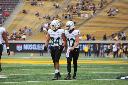  Junior quarterback Jake Dunniway (12) and junior wide receiver Pierre Willams (84) stand side by side walking off the field at California Memorial Stadium on Sept.18, 2021. The Hornets pulled out a slim 23-21 victory in their game against Idaho State on Saturday.