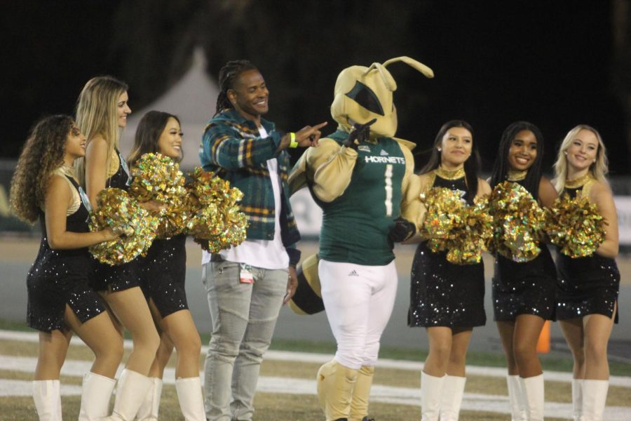 Herky and cheerleaders pose with Sacramento State alum and Super Bowl 50 champion Todd Davis on Oct. 23, 2021, at Hornet Stadium. Sac State hosted Northern Arizona for their homecoming game, shutting them out 44-0.