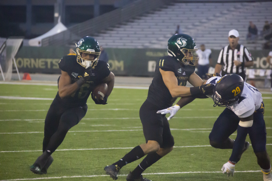  Sophomore tight end Marshel Martin (16) cuts upfield behind sophomore wide receiver Parker Clayton (11) at Hornet Stadium on Oct. 23, 2021. The Hornets shut out the Lumberjacks 44-0 on Saturday.