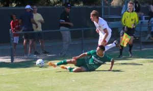 Hornet junior midfielder Oscar Govea is tripped up as the ball goes out of play on Sunday, Sept. 19, 2021, against Saint Marys in a 1-0 loss for the Hornets. The Hornets have averaged just 1.25 goals on the year.
