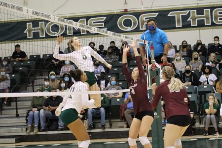 Sophomore outside hitter Bridgette Smith (8) gets ready to send the ball to the Montana Grizzlies defense at the Hornets Nest on Nov. 11, 2021. Smith had 13 kills and seven digs in the match against the Grizzlies.
