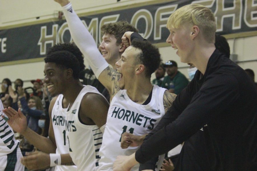 Sac+State%E2%80%99s+bench+celebrates+after+a+lob+dunk+by+sophomore+combo+forward+Cameron+Wilbon+on+Thursday%2C+Nov.+4%2C+2021%2C+at+the+Hornets+Nest.+The+Hornets+defeated+the+Red+Hawks+after+a+second+half+surge.%0A