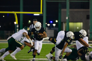 Senior wideout Isaiah Gable (4) charges up the middle behind freshman running back Cameron Skattebo (32) for a big gain at Hornet Stadium on Nov. 6, 2021. The Hornets’ offense netted 195 rush yards in their 41-9 win against the Cal Poly Mustangs.