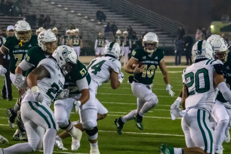 Sacramento State quarterback Asher O’Hara runs behind blockers in search of a hole to run through against Portland State at Hornet Stadium on Saturday, Nov. 13, 2021. O’Hara leads the team in total touchdowns this season with 14. 