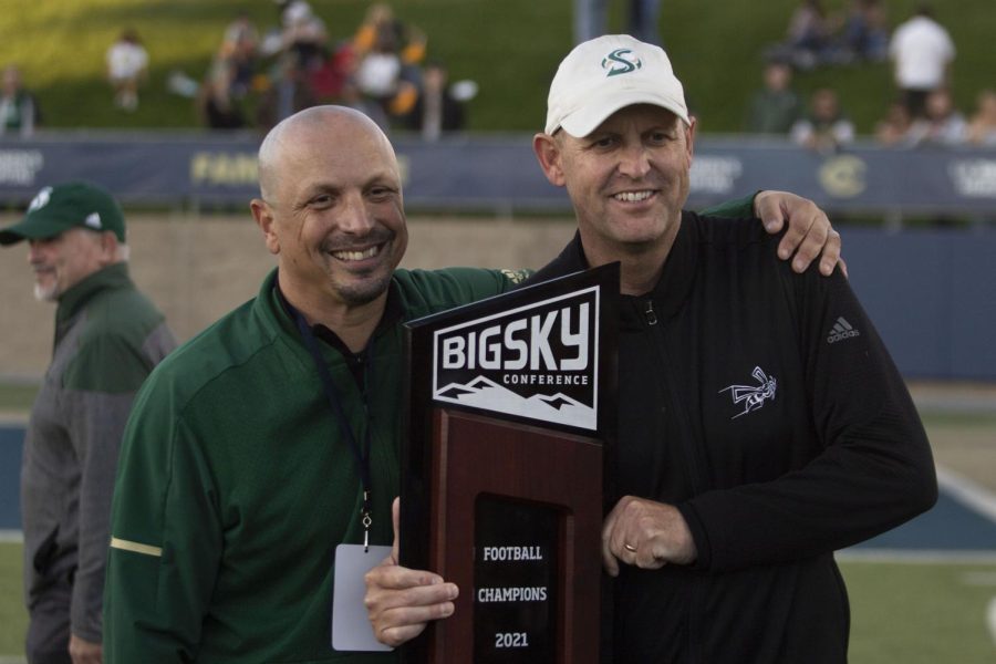 Athletic director Mark Orr and Head coach Troy Taylor hold up the 2021 Big Sky Conference trophy at UC Davis Health Stadium on Nov. 20th 2021. Taylor led the Hornets to a 27-7 victory against the Aggies at the Causeway Classic.