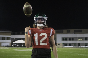 Sac State junior quarterback poses as he tosses a football in the air after practice on Wednesday, Nov. 10, 2021. Dunniway leads the Hornets in passing yards (2051) and passing touchdowns (11) this season. 
