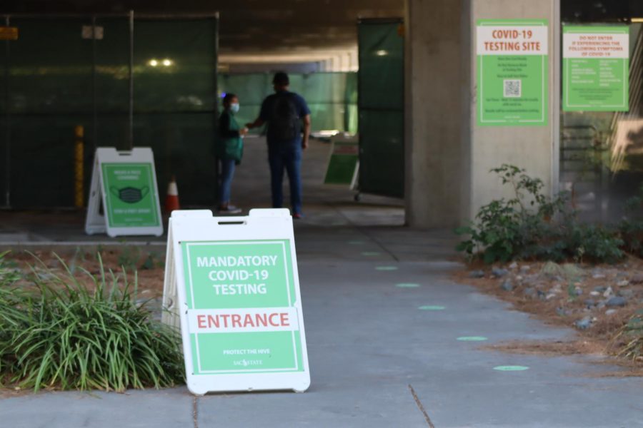 Sacramento State students with exemptions to the COVID-19 vaccine requirement test for COVID-19 at the testing site in parking structure III across from The WELL on Sept. 30, 2021. All Sac State students are able to test at the site using their OneCard. 