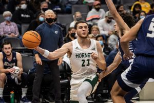 Senior forward Bryce Fowler attempts a wrap-around pass on Tuesday, Nov. 24, 2021, at Golden 1 Center against UC Davis. The Hornets handled the Aggies in a dominant 75-63 in the return of the Causeway Classic.