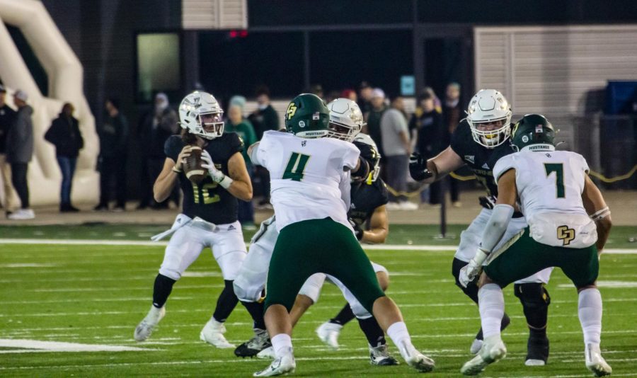 Junior+quarterback+Jake+Dunniway+drops+back+for+a+pass+against+Cal+Poly.+Sac+State+beat+Cal+Poly+41-9+on+Nov.+6+at+Hornet+Stadium.%0A
