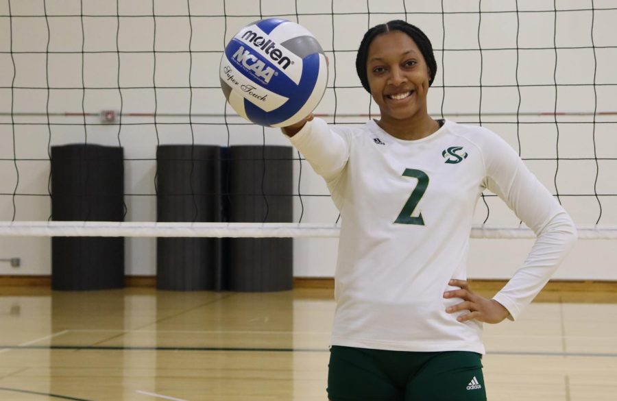 Senior middle blocker Cianna Andrews poses with a ball in hand inside the Sacramento State volleyball team’s practice gym on Tuesday, Nov. 8, 2021. Andrews recently returned to the team after recovering from an injury and was named Big Sky defensive player of the week in October. 