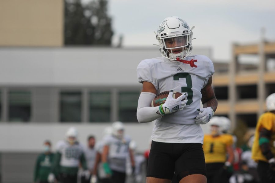 Freshman wide receiver Chris Miller (3) finishes off a catch at practice on Oct. 19, 2021, at Hornet Stadium. Miller scored his first touchdown of the season and his career as a Hornet on Oct. 16 against Montana.
