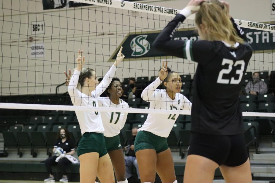 Outside hitters Bridgette Smith (8), Tiyanane Kamba-Griffin (17) and middle blocker Kalani Hayes (12) prepare for an incoming serve from Portland State at the Hornets Nest on Oct. 19, 2021. The Hornets defeated Portland State on the road in four sets in an away matchup on Thursday. 