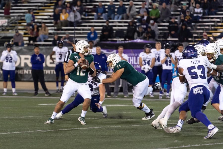 Sac State sophomore quarterback Jake Dunniway (12) prepares to throw against Weber State on Nov. 2 at Hornet Stadium. In his first start of the season, Dunniway completed 27 of 44 passes for 384 yards, four touchdowns and one interception in the 38-34 win at Northern Arizona on Saturday. 