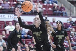 Senior guard Summer Menke going after a loose ball on Thursday, Dec. 2, 2021. Sacramento State lost to the University of Montana 75-59 in their first conference matchup on the road.
