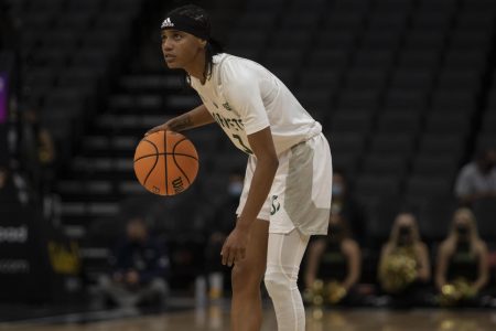 Graduate guard Lianna Tillman handles the ball at the top of the key in a 75-46 loss against UC Davis at the Golden 1 Center on Nov. 23, 2021. Tillman was a key player in Sac State’s defeat of Portland State University 70-58 on Saturday, Jan 15, 2021.