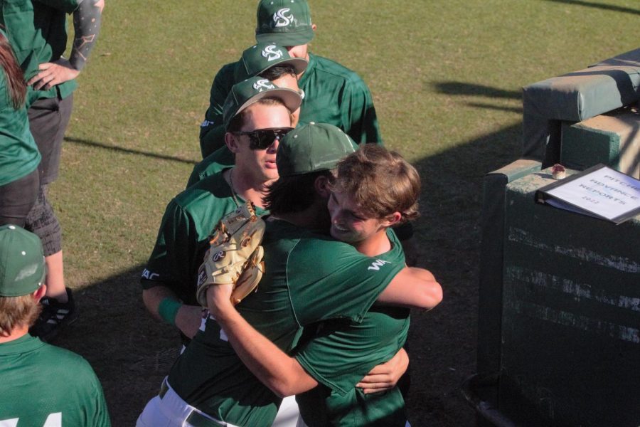 Sac State teammates celebrate with freshman pitcher Colin Hunter(right) after Hunter’s first collegiate start on Feb. 19, 2022 against Northern Illinois at John Smith Field. Hunter’s debut was spectacular as he threw the second ever Div.I no-hitter in Sac State history, Hunter had nine strikeouts and allowed no walks.