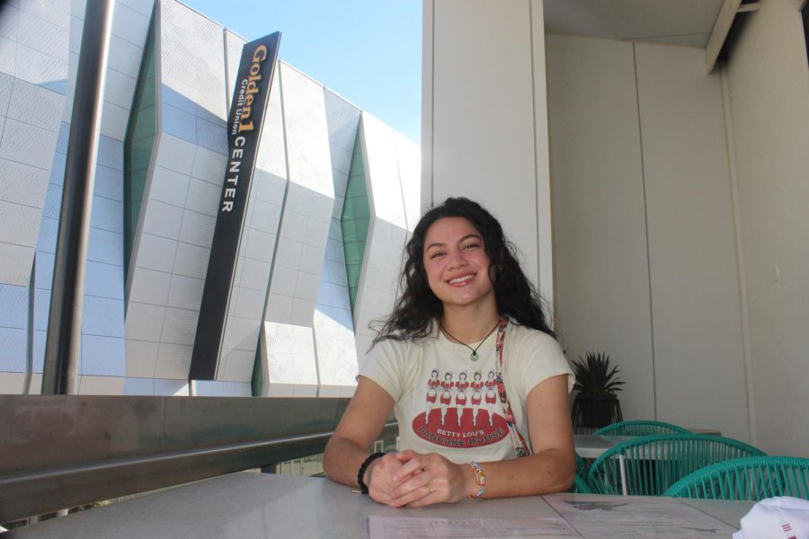  Kinesiology major Malia Tuitavuki sits at a dining table in front of the Golden 1 Center in Sacramento on Feb. 9. She will be graduating at the arena in May for the first in-person graduation commencement since the beginning of the COVID-19 pandemic in 2020.