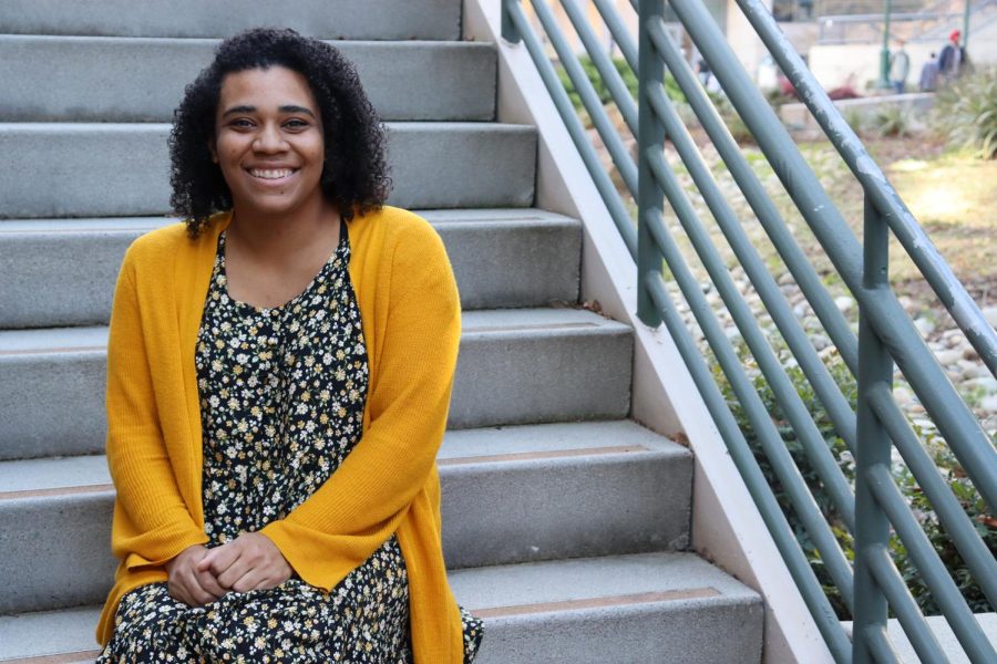 Terryia Davis, a nutrition major at Sac State, poses on the stairs in front of the University Union on Friday, Feb. 07, 2022. One of Davis’s biggest concerns with being on campus is the lack of adequate social distancing from students in her class.