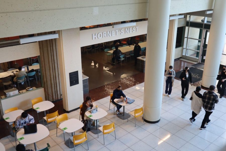 Students crowd the University Union on the first day after returning from a two-week delay of in-person instruction Friday, Feb. 07, 2022. Students are required to wear masks in all indoor facilities but not outdoors.