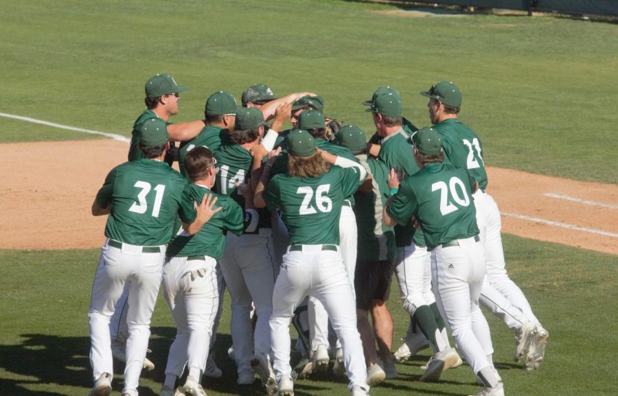The Sac State baseball team swarms freshman starting pitcher Colin Hunter on Feb.19, 2022 at John Smith Field after he threw   the second no-hitter in Sac State Division 1 history. Hunter recorded nine strikeouts and didn’t allow a walk in his collegiate debut.
