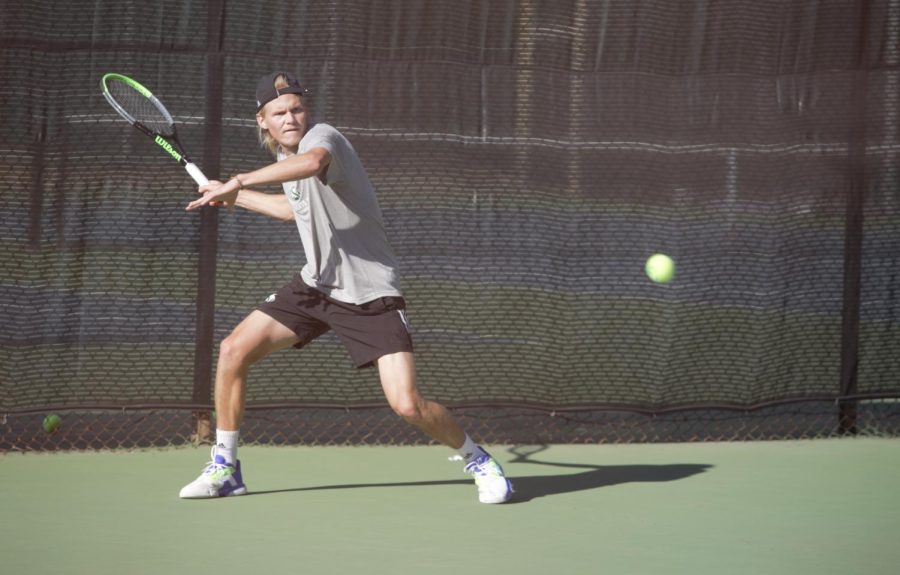 Sac State sophomore Rudolfs Aksenoks returns a serve to teammate Mate Voros on the other side of the court, Wednesday, Feb. 9, 2022, Asenoks is 4-0 this season in singles matches.  
